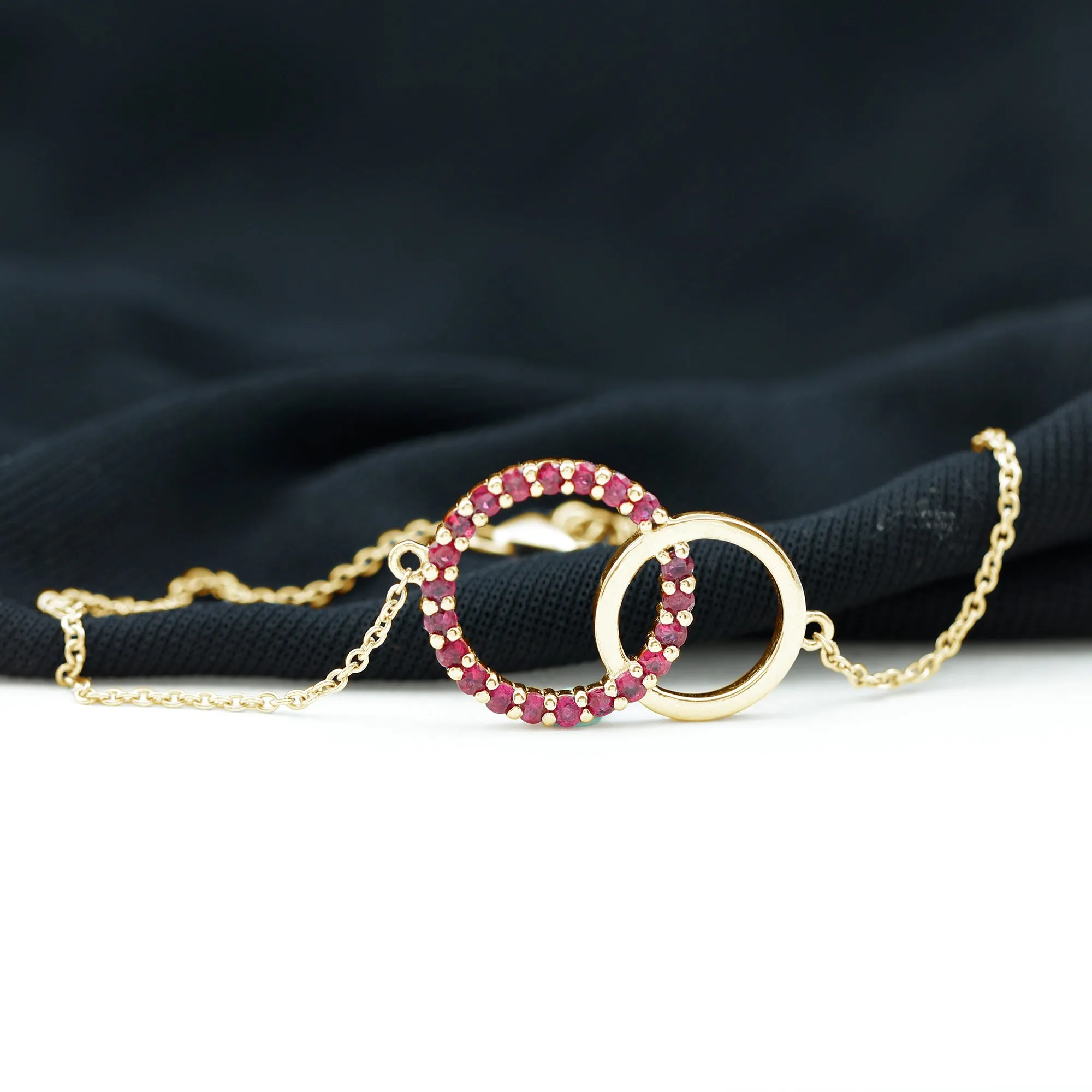 0.75 CT Round Cut Ruby Interlock Chain Eternity Bracelet in Prong Setting