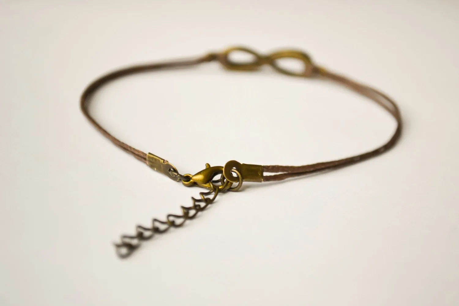 Handmade dainty brown cord anklet with bronze infinity charm