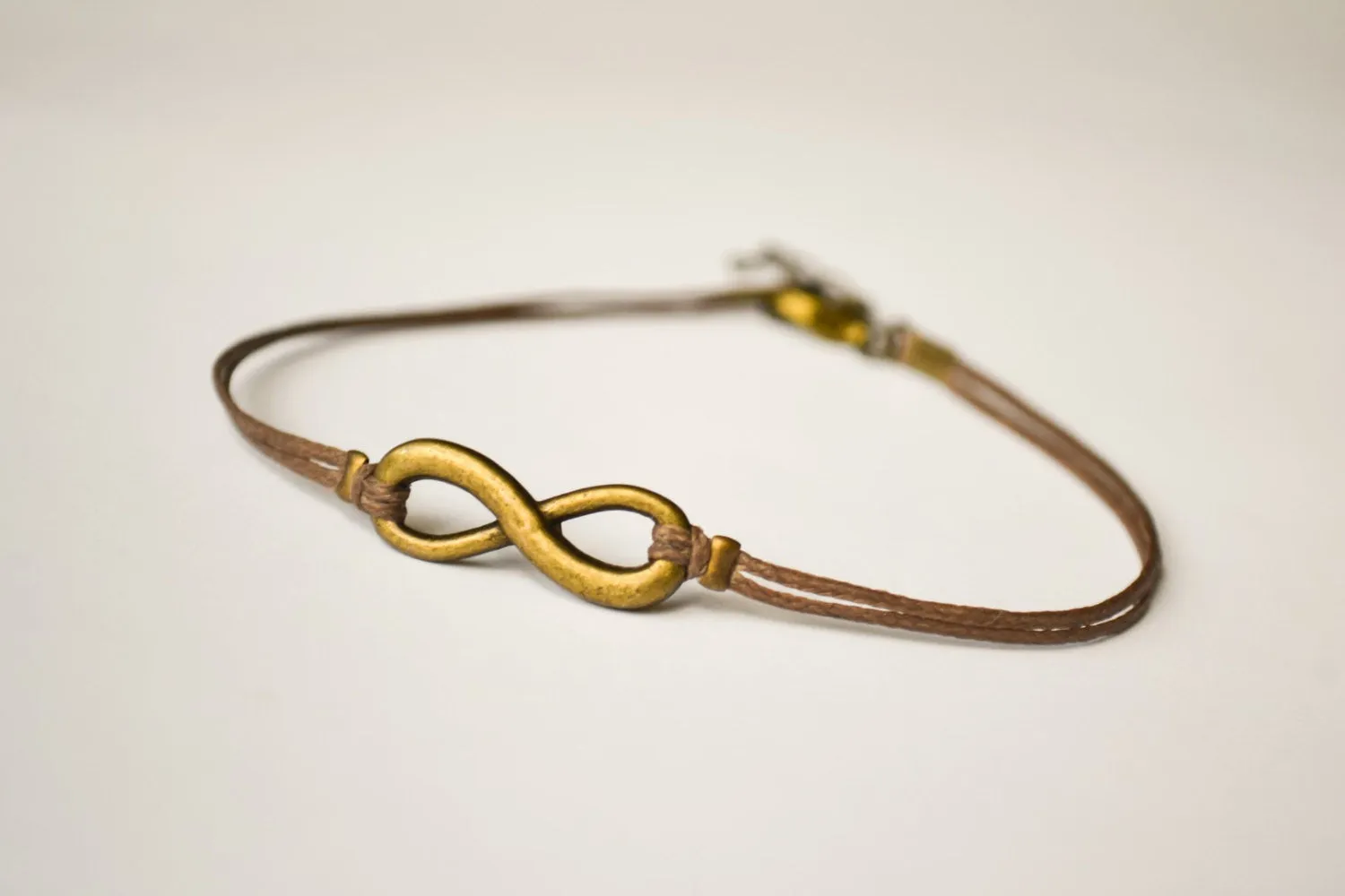 Handmade dainty brown cord anklet with bronze infinity charm