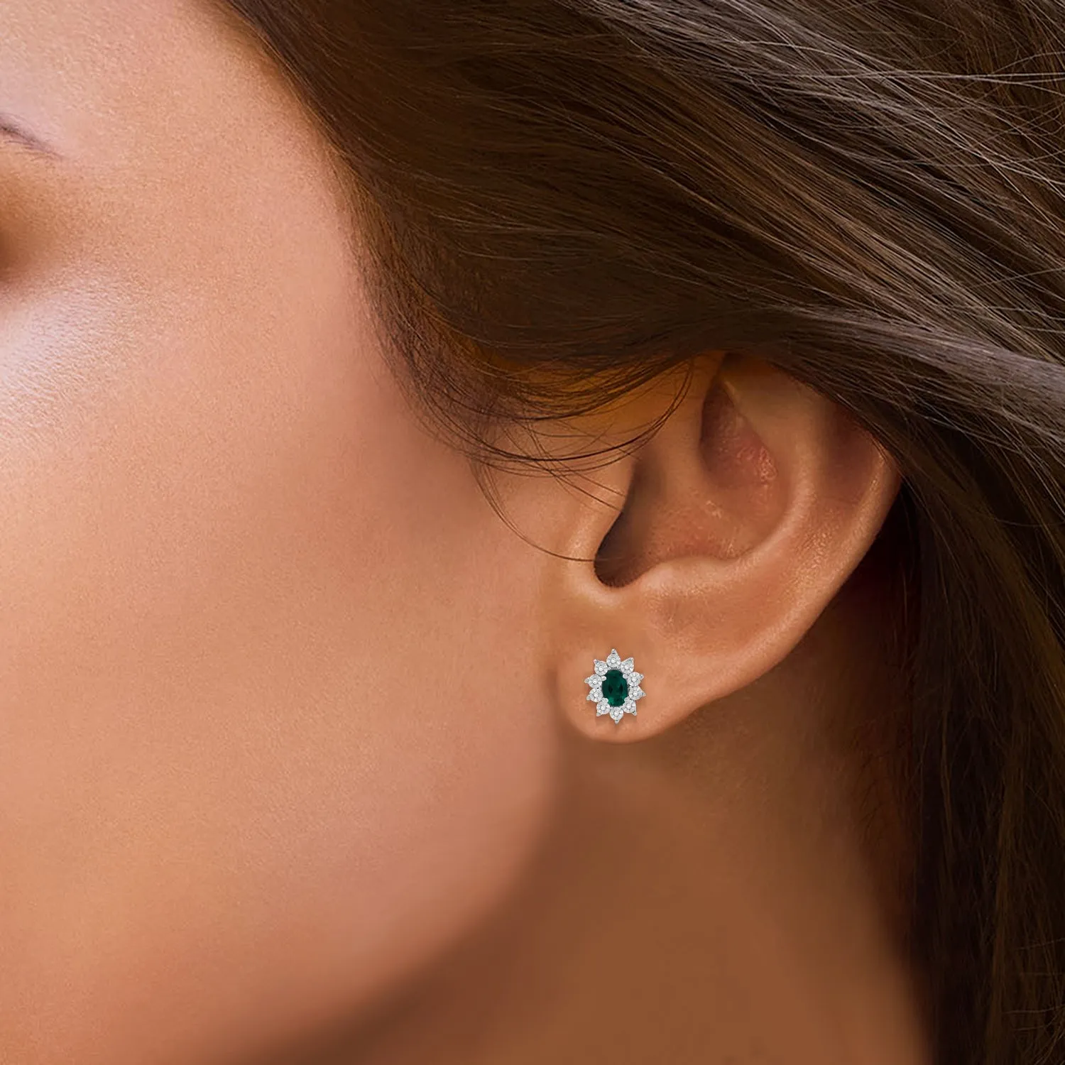 Jewelili Sterling Sliver 6x4 MM Oval Created Emerald and 1/20 Cttw Natural White Round Diamond Cluster Stud Earrings