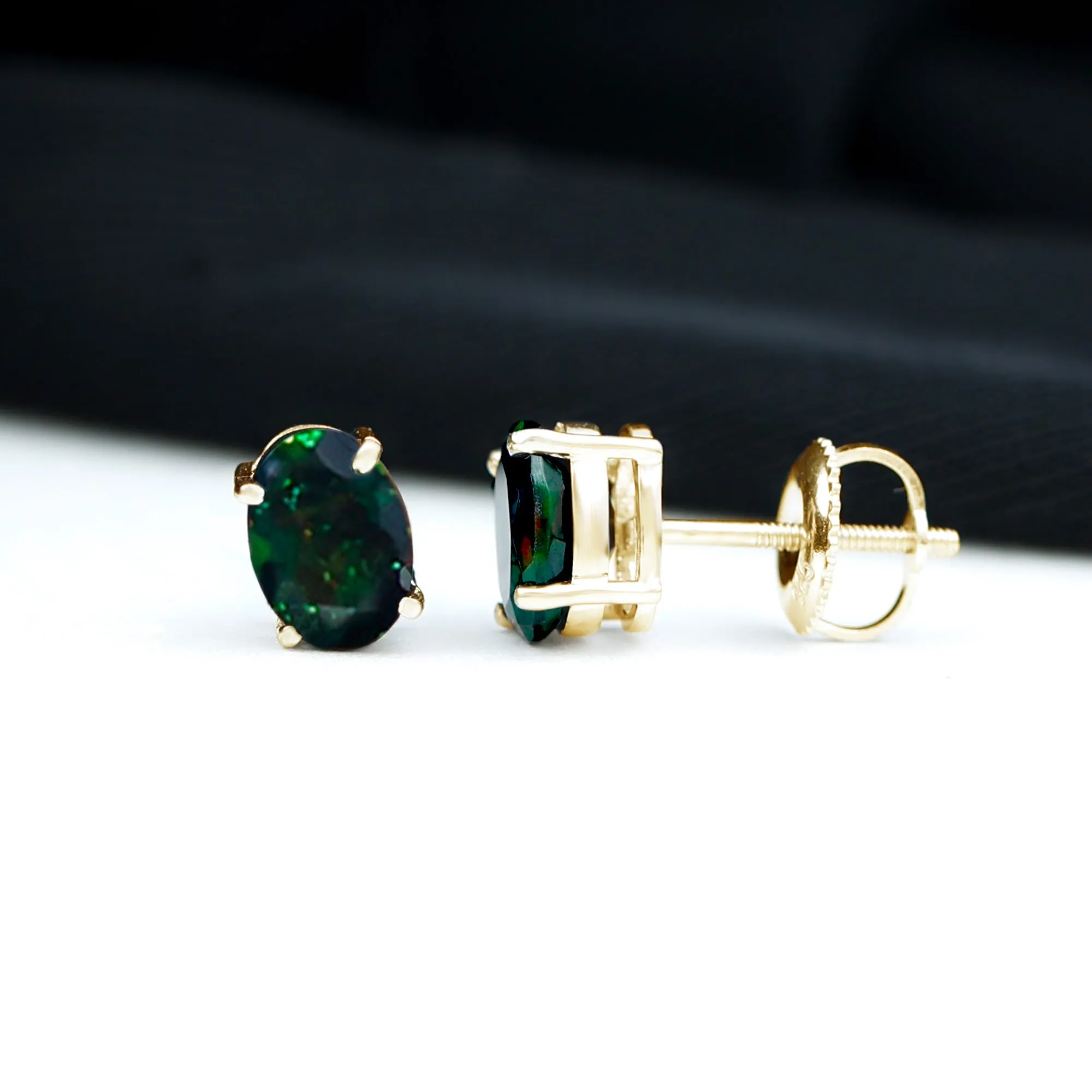 Oval Cut Black Opal Solitaire Stud Earrings in 4 Prong Setting